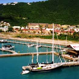 Two-masted sail boat at dock.