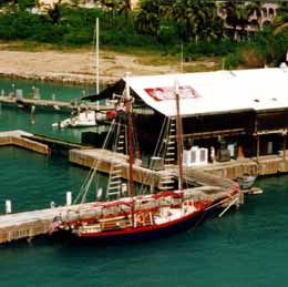 Two-masted sail boat at dock.